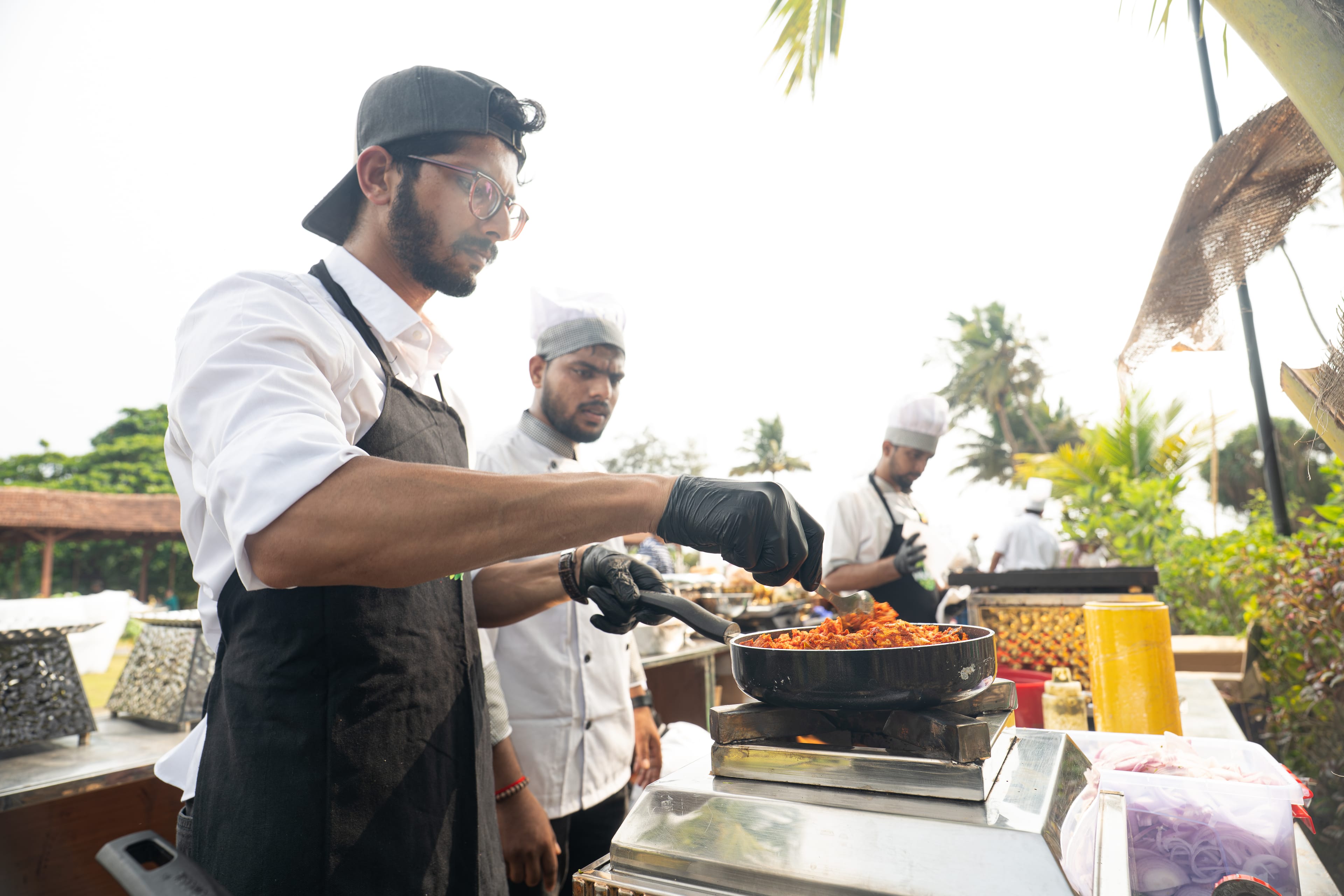 Wakao Khao chef cooking jackfruit live at an event counter